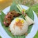 A traditional Malaysian dish featuring marinated meat, fried rice and celery stalks